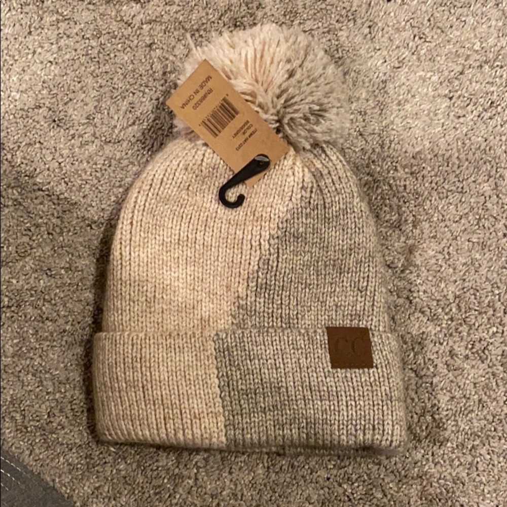 Selling C.C beanie with puff ball on the top!